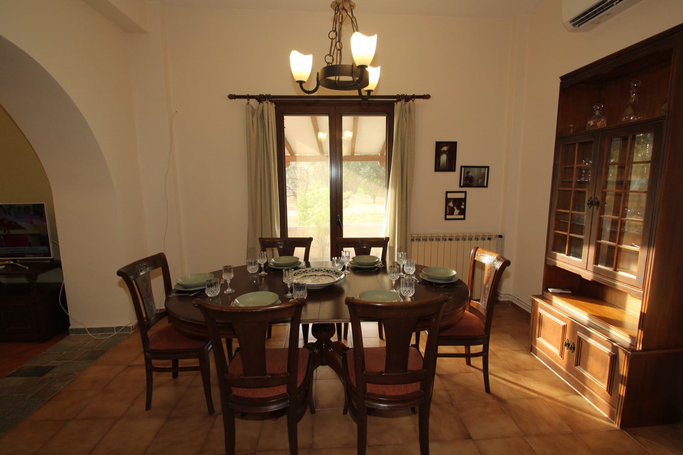 Dining room at Fistiki House seating six, with garden views