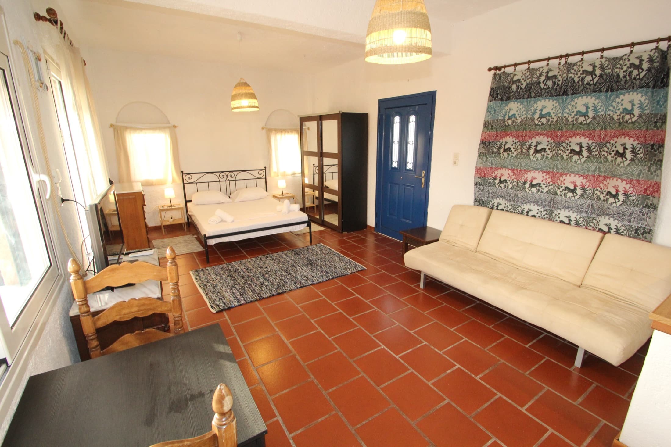 Open-plan living and sleeping area at Fistiki Studio